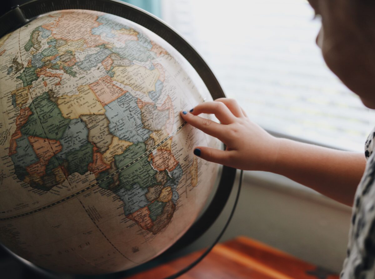 Child looking at globe